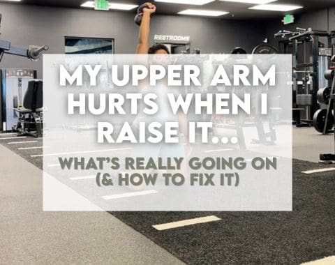 Someone who is performing an overhead shoulder kettlebell exercise at the gym